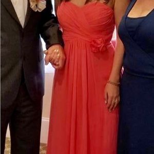 Peach colored long dress, strapless.